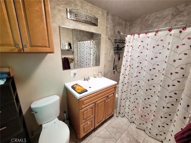 bathroom with a shower with shower curtain, vanity, toilet, and tile patterned flooring