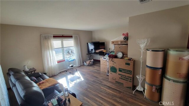 living room featuring dark hardwood / wood-style flooring