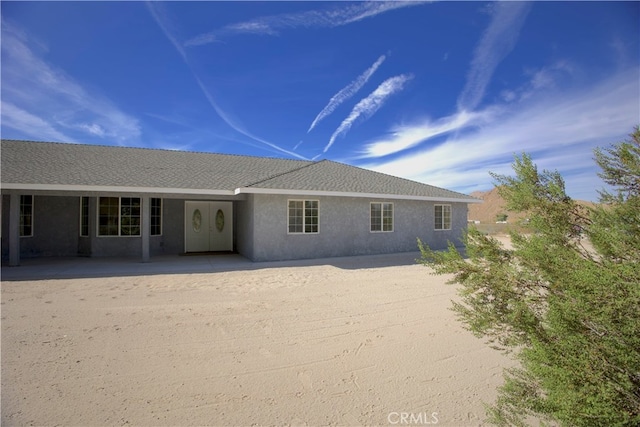 back of property with a patio area