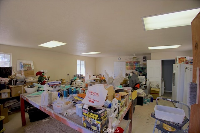 misc room with a healthy amount of sunlight and ceiling fan