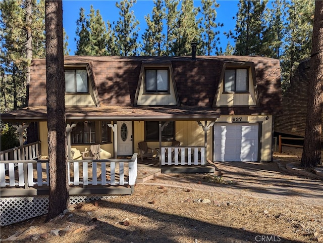 view of front facade with covered porch and a garage