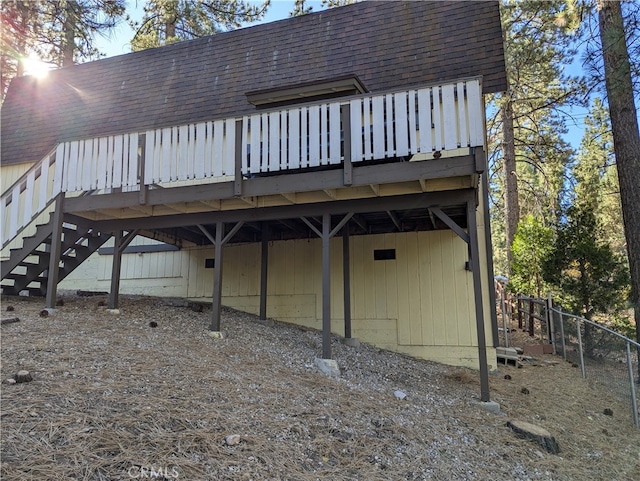 back of house with a wooden deck