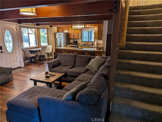 living room with sink and dark hardwood / wood-style floors