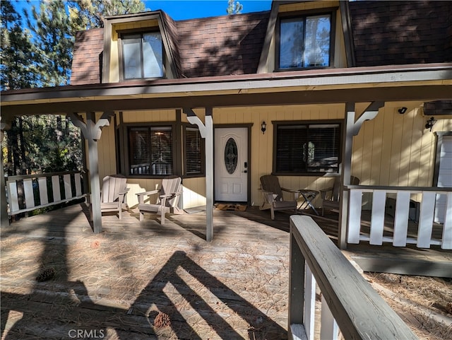 property entrance with covered porch