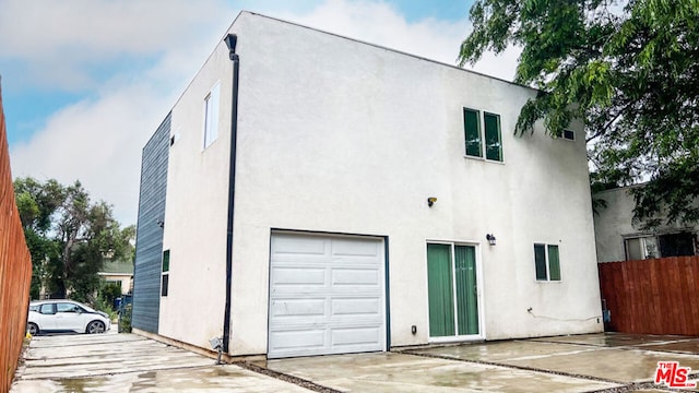 view of side of property featuring a garage