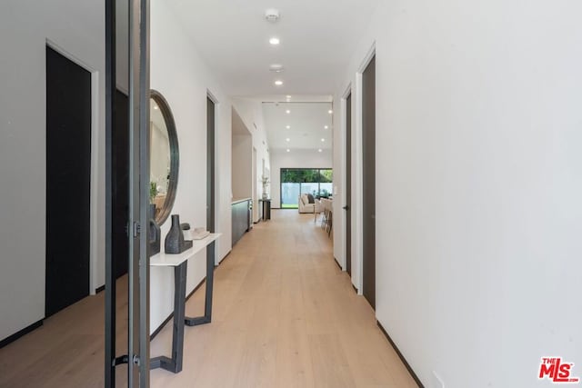 corridor featuring light wood-type flooring