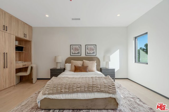 bedroom with light hardwood / wood-style flooring