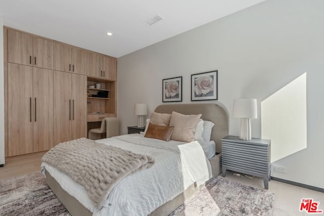 bedroom featuring light hardwood / wood-style flooring