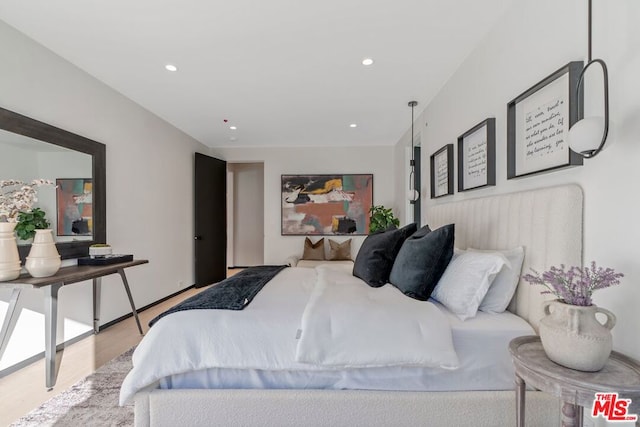 bedroom with light hardwood / wood-style floors