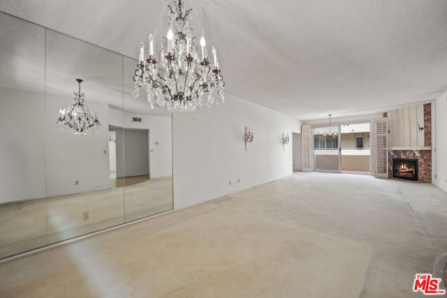 unfurnished living room featuring a textured ceiling and a fireplace