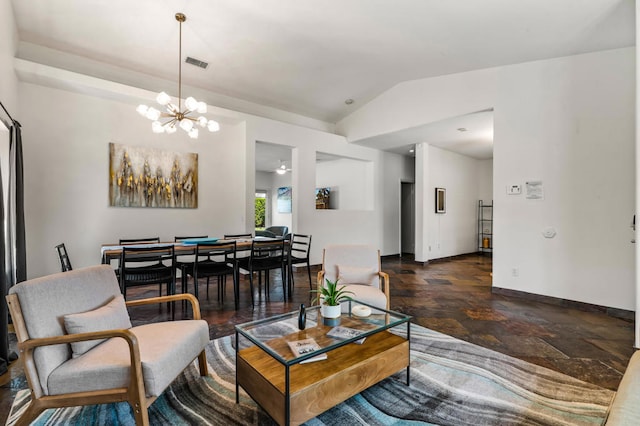 living room with vaulted ceiling and a notable chandelier