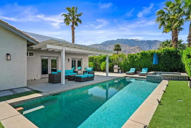 view of pool with a patio, a pergola, an outdoor living space, a mountain view, and an in ground hot tub