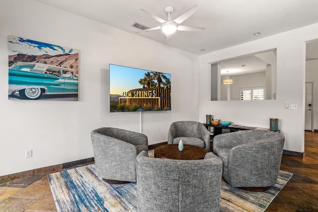 living area with ceiling fan