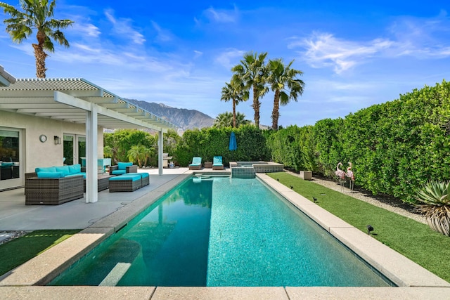 view of pool featuring an in ground hot tub, a patio, a pergola, an outdoor living space, and a mountain view