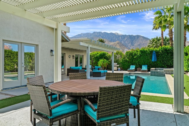 view of patio / terrace with a pergola, a mountain view, a swimming pool with hot tub, and an outdoor living space