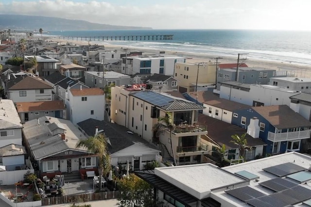 aerial view featuring a view of the beach and a water view