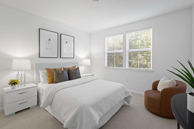 bedroom with light colored carpet