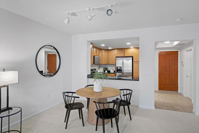 view of carpeted dining area