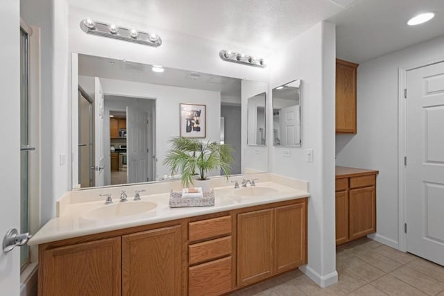 bathroom featuring tile patterned floors and vanity