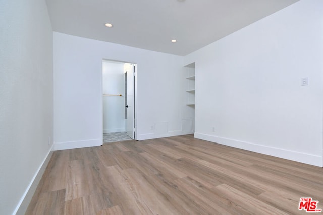 unfurnished room with light hardwood / wood-style flooring