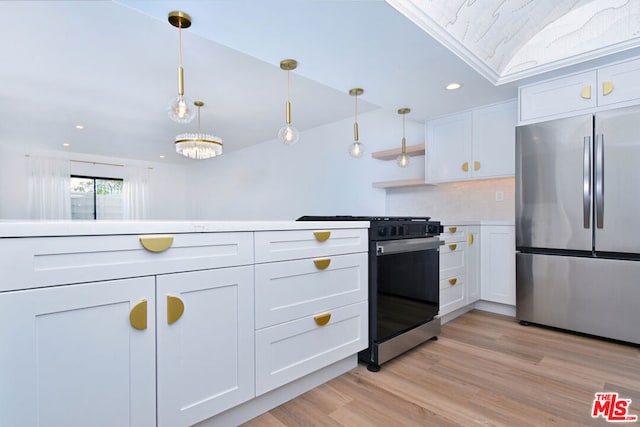 kitchen featuring stainless steel appliances, a chandelier, pendant lighting, light hardwood / wood-style floors, and white cabinets