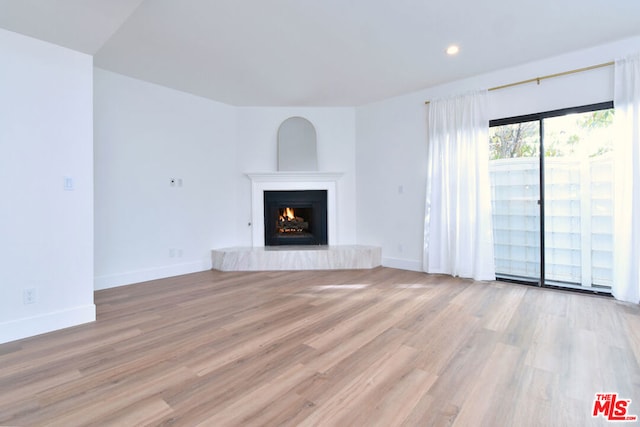 unfurnished living room featuring light wood-type flooring