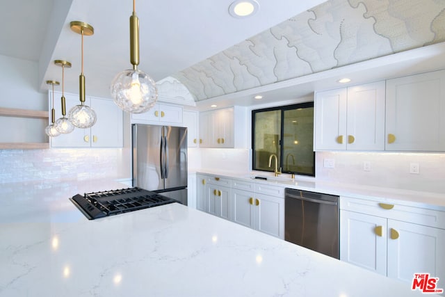 kitchen featuring white cabinets and appliances with stainless steel finishes