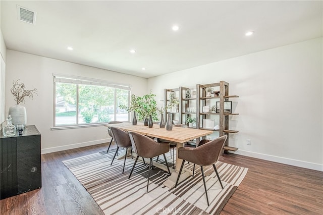 dining area with dark wood-type flooring