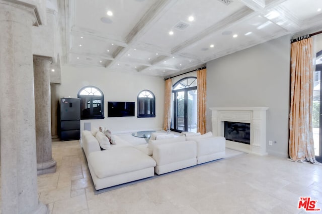 living room with beamed ceiling, ornamental molding, and coffered ceiling