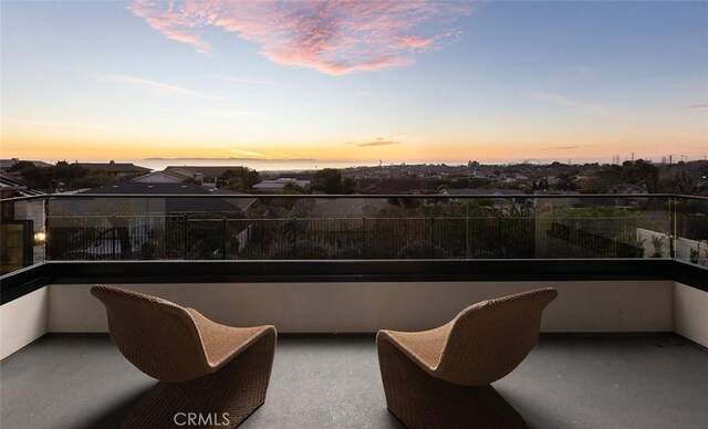 view of balcony at dusk