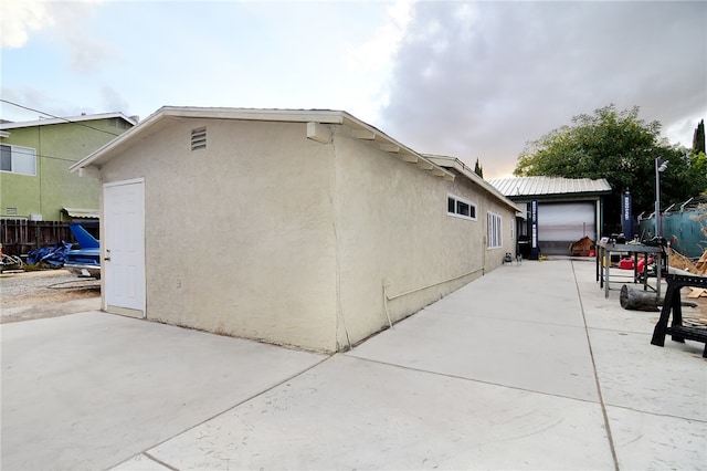 view of property exterior with a garage