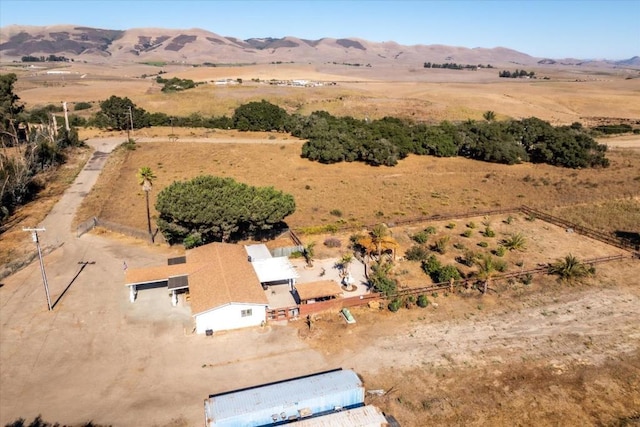 drone / aerial view with a mountain view and a rural view