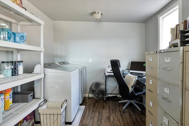 laundry room with dark hardwood / wood-style flooring and washing machine and clothes dryer