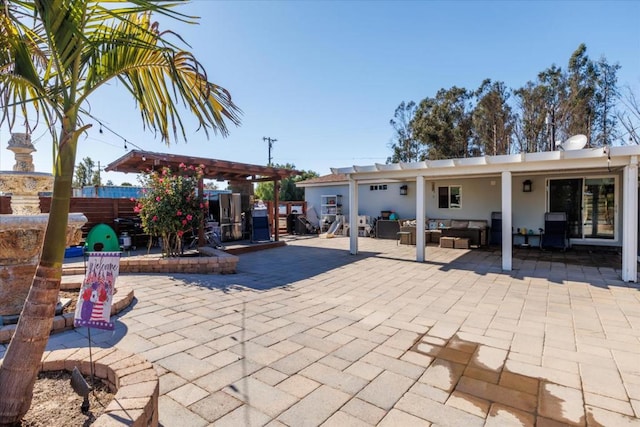 exterior space featuring a pergola, a patio, and an outdoor hangout area