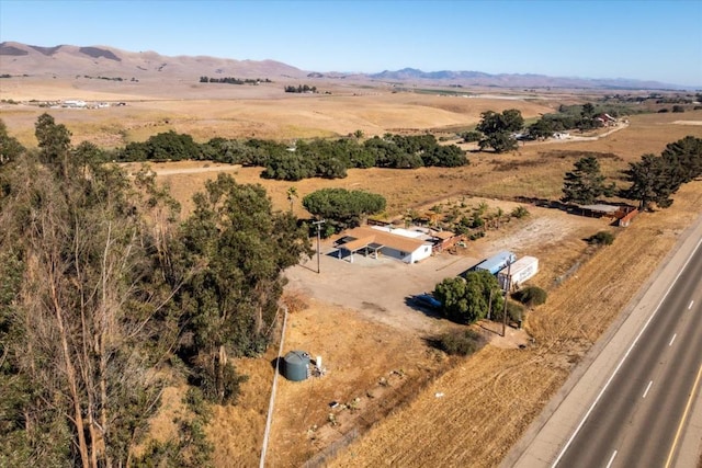 birds eye view of property featuring a mountain view and a rural view