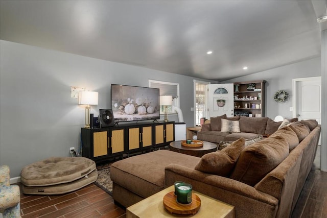 living room featuring dark hardwood / wood-style flooring and vaulted ceiling