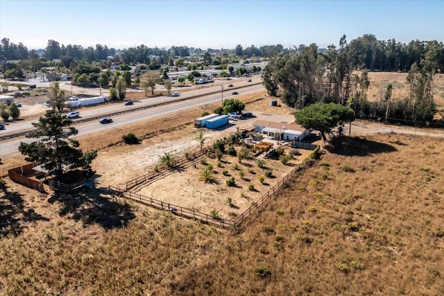 birds eye view of property with a rural view