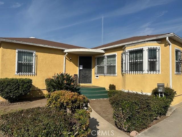 315 E 118th St, Los Angeles, CA 90061 - view of front of property featuring stucco siding