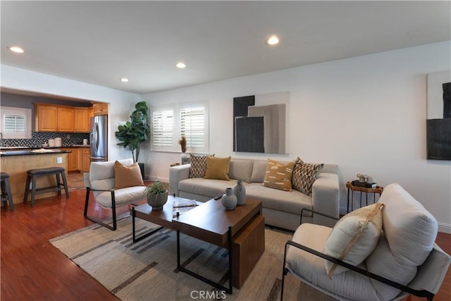 living room with dark hardwood / wood-style flooring