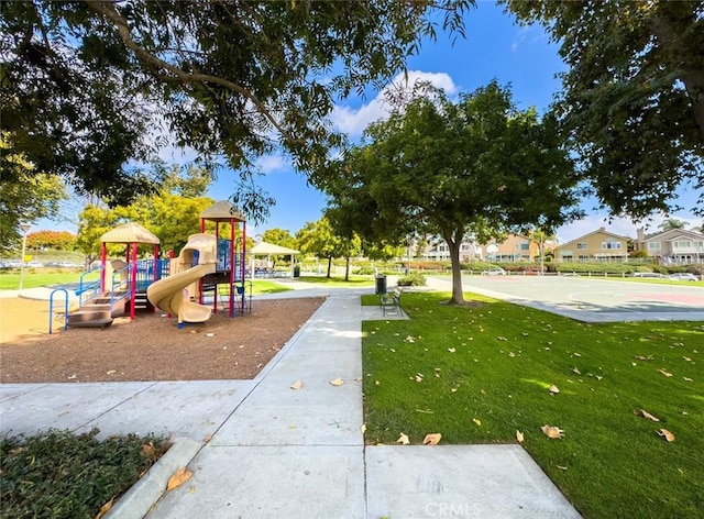 view of playground with a lawn