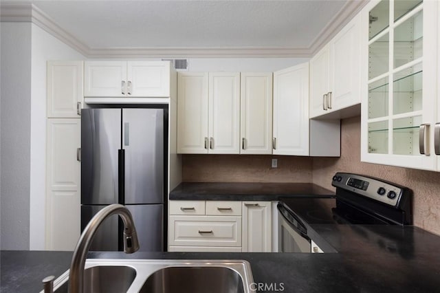 kitchen featuring white cabinets, sink, ornamental molding, and stainless steel appliances