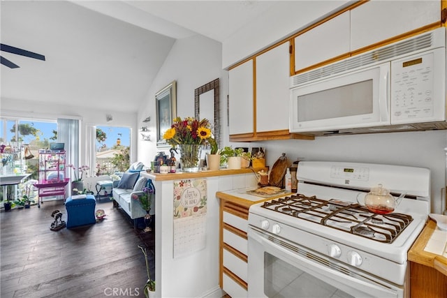 kitchen with lofted ceiling, white cabinets, ceiling fan, dark hardwood / wood-style floors, and white appliances