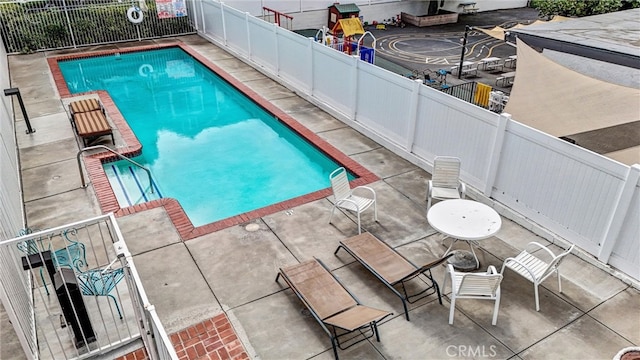 view of pool with a patio