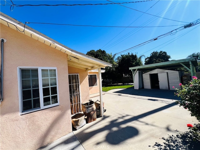 view of patio with a storage unit