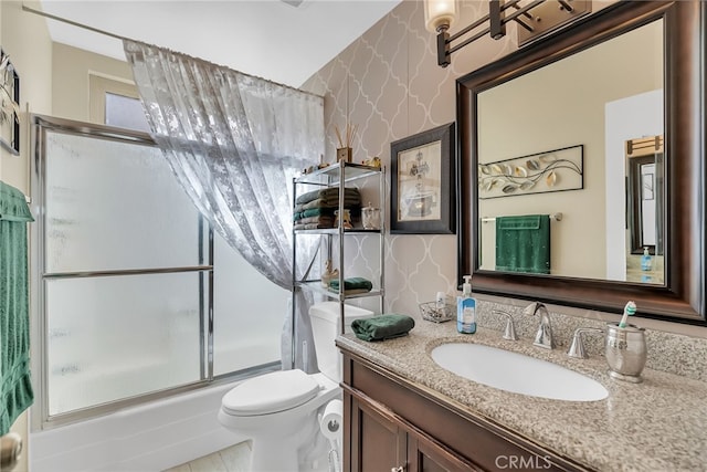 26725 Farrell St, Menifee, CA 92586 - full bathroom featuring wallpapered walls, vanity, shower / bath combination with glass door, and toilet