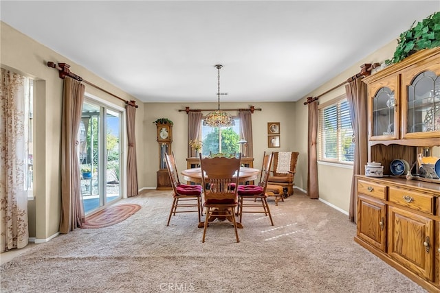 26725 Farrell St, Menifee, CA 92586 - dining space with plenty of natural light, light carpet, baseboards, and a chandelier