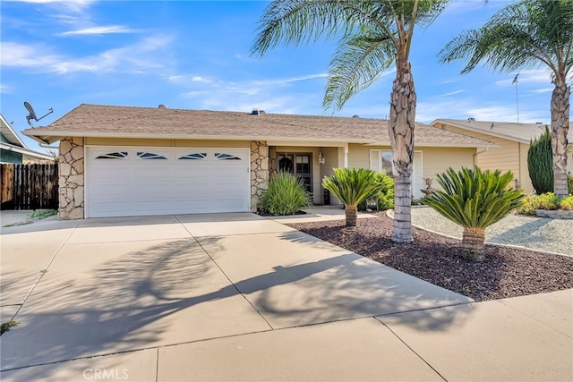 26725 Farrell St, Menifee, CA 92586 - ranch-style house featuring stone siding, concrete driveway, an attached garage, and fence