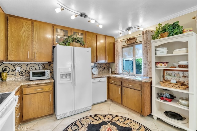 26725 Farrell St, Menifee, CA 92586 - kitchen with white appliances, a sink, backsplash, and brown cabinetry