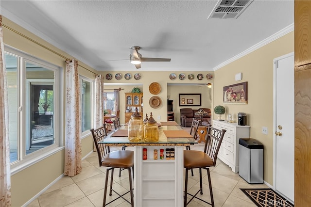 26725 Farrell St, Menifee, CA 92586 - dining area with light tile patterned floors, a ceiling fan, a textured ceiling, baseboards, and crown molding