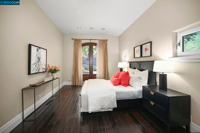 bedroom with dark hardwood / wood-style flooring and french doors